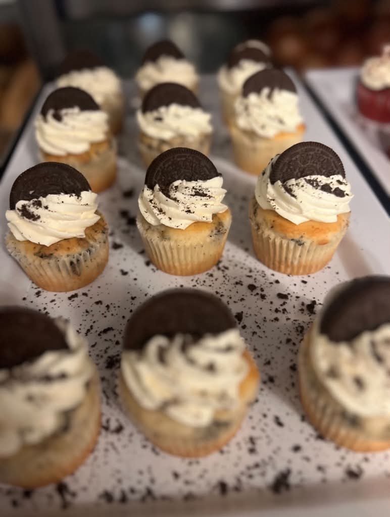 Cookies and cream cupcakes topped with half an Oreo